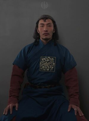 Mongolian Men’s Wearing Deel and Sitting
