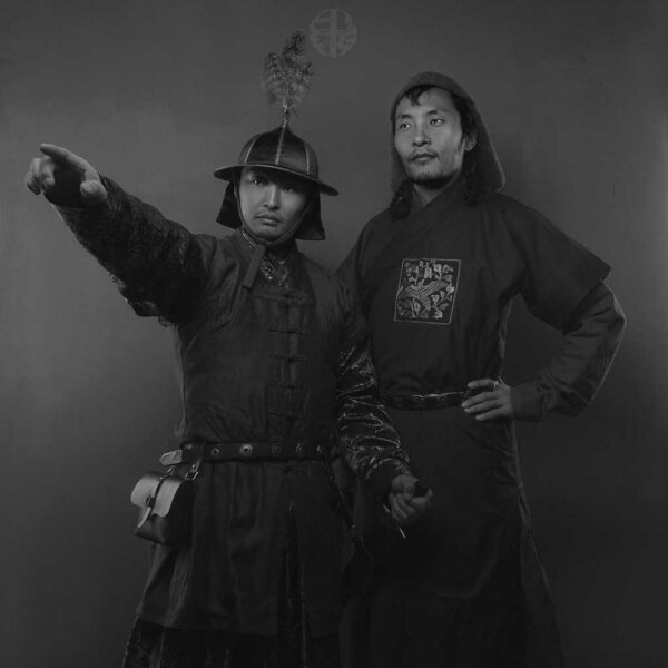 Mongolian Men's Wearing Deel and Pointing