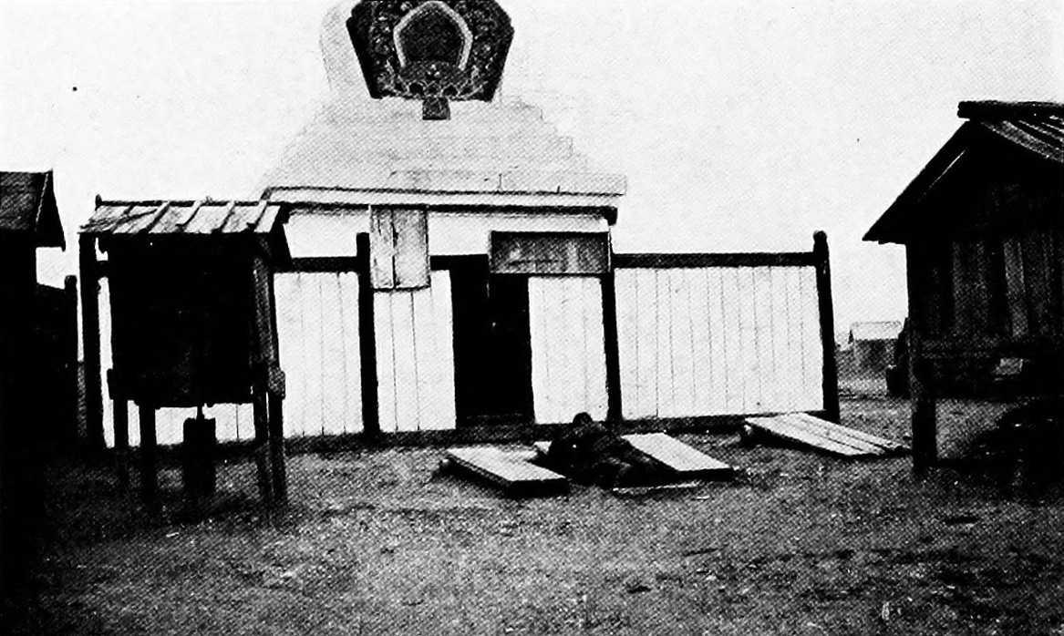 Mongol praying at a shrine in urga